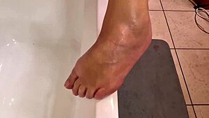 Sexy slut rubs oil on her body while masturbating