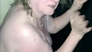 Mature European Woman Enjoys Femdom Session With Slave At Glory Hole, Getting Blowjob