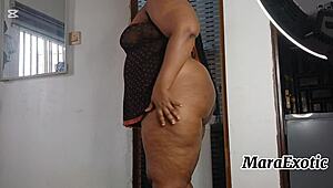 ebony nigerian woman in lingerie does laundry