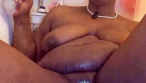 Black milf shaves her wet pussy for orgasm. She uses toys in homemade close-up.