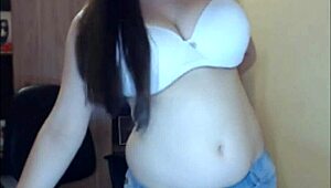 This teen on webcam shows off her huge natural tits, teasing viewers live on sluttylivecams com