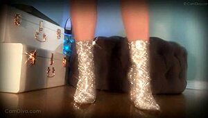 in the dungeon, the femdom goddess mesmerizes her slave with her sparkle boots, commanding him to lick her ass while she teases with her legs