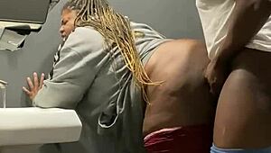 Milf gets backshots in bar bathroom