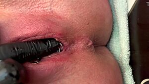 Woman Rubs Pierced Area With Gloves And Experiences Strong Urination