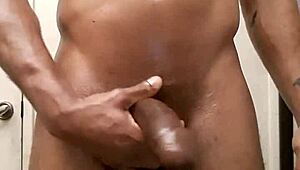 i rub oil on my big black cock after shower masturbation