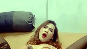 Ladyboy Mint jerks off and swallows cum.