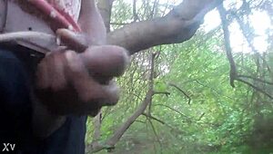 outdoor masturbation session ends with a cum shot in the trees