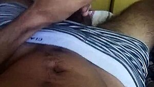 In this guided masturbation session, the young brazilian girl moans while stroking her huge cock and talking dirty in the bedroom