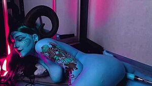 Tattooed blue-eyed slut with huge tits gets pounded by machine.