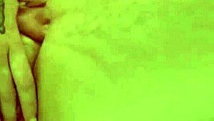 Babe relaxes in bathtub, gently touching her body softly