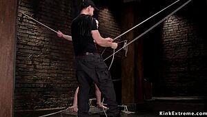 brunette uses toys in restrictive bondage position