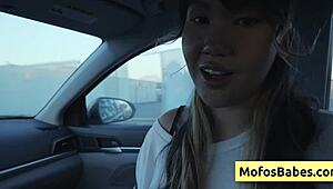 sexy asian hottie plays with natural big boobs in car