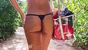 Hairy babe walking and jogging topless in thong, flashing in forest