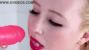 Samantha Rone pounds her pink toy in the shower.