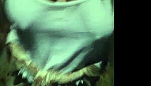 A beautiful curvy woman with big natural tits shows her boobs in public while walking outdoors