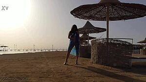 Young blonde goes pantyless on public beach