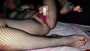 This 40-year-old housewife shows off her hairy pussy in fishnet stockings for foot fetish fun