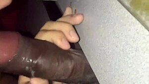 Homemade bbw amateur slut performs sloppy blowjob at gloryhole. She swallows cum from big black cock.