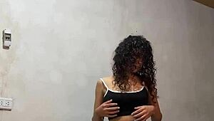 Hidden cam captures Colombian university babe undressing, her perfect body and big tits on display.