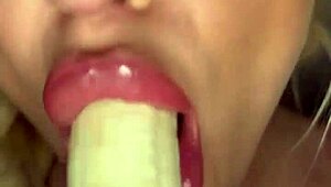 Horny college girl intensely sucks on a big banana teasingly
