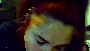 sexy redhead giving a blowjob