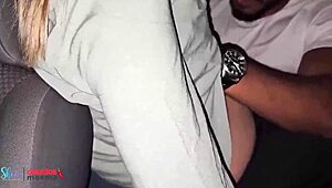 The husband watches his wife mingle at the group gathering in the car