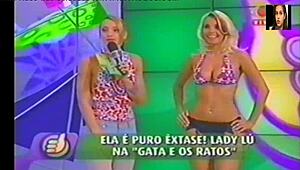 i watch lady lu doin her super positve striptease, rippin her clothes off on brazilian tv