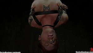 Redhead lesbian bound in latex lingerie endures rough lezdom whipping