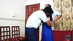 Two students engage in heated session in staff office post-school.