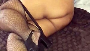 Look at Beruka, my horny wife, displaying her wet, shaved pussy in open fishnets