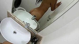 this brazilian teen is masturbating in the bathroom, showing her big ass