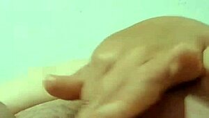 abuela playing with her big carrot in the bedroom