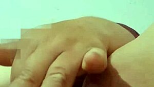 abuela playing with her big carrot in the bedroom