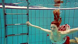 hot teen marketa dives underwater in bikini at beach