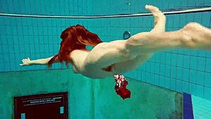 hot teen marketa dives underwater in bikini at beach