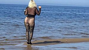 mature blonde teases big tits and ass flashing naturally on beach
