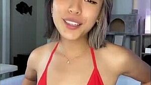 relaxing by the pool in a skimpy bikini on a sunny day