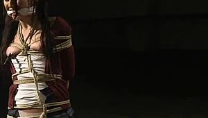 Gagged lesbian clamped tight endures kinky anal submission ordeal