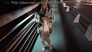 Luscious milf struts braless pantyless on bridge