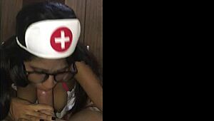 Latina Nurse Cares For Young Patient In Hospital