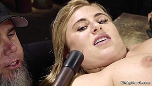 busty blonde slave bound tight in throne. she gags chokes on rough cock.
