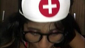 Latina Nurse Cares For Young Patient In Hospital