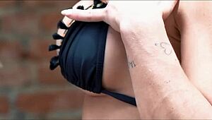 Wow sexy Luiza Marcato rubs her shaved pussy wet in the garden all alone!