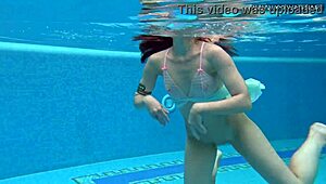 Hottest underwater babe Lizi Vogue swims in tight dress pool