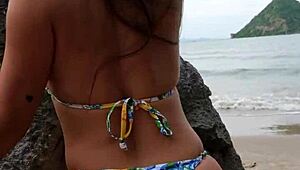 This petite tanned girl next door dances bikini on tropical beach, flashing ass casually