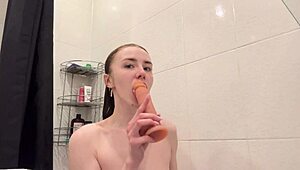 pretty redhead cutie locks shower door fingers her curvy body all day