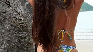 This petite tanned girl next door dances bikini on tropical beach, flashing ass casually