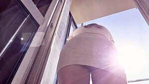 latina babe flashes shaved pussy and ass on balcony without panties